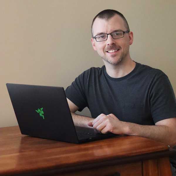 Dave Judd sitting with laptop